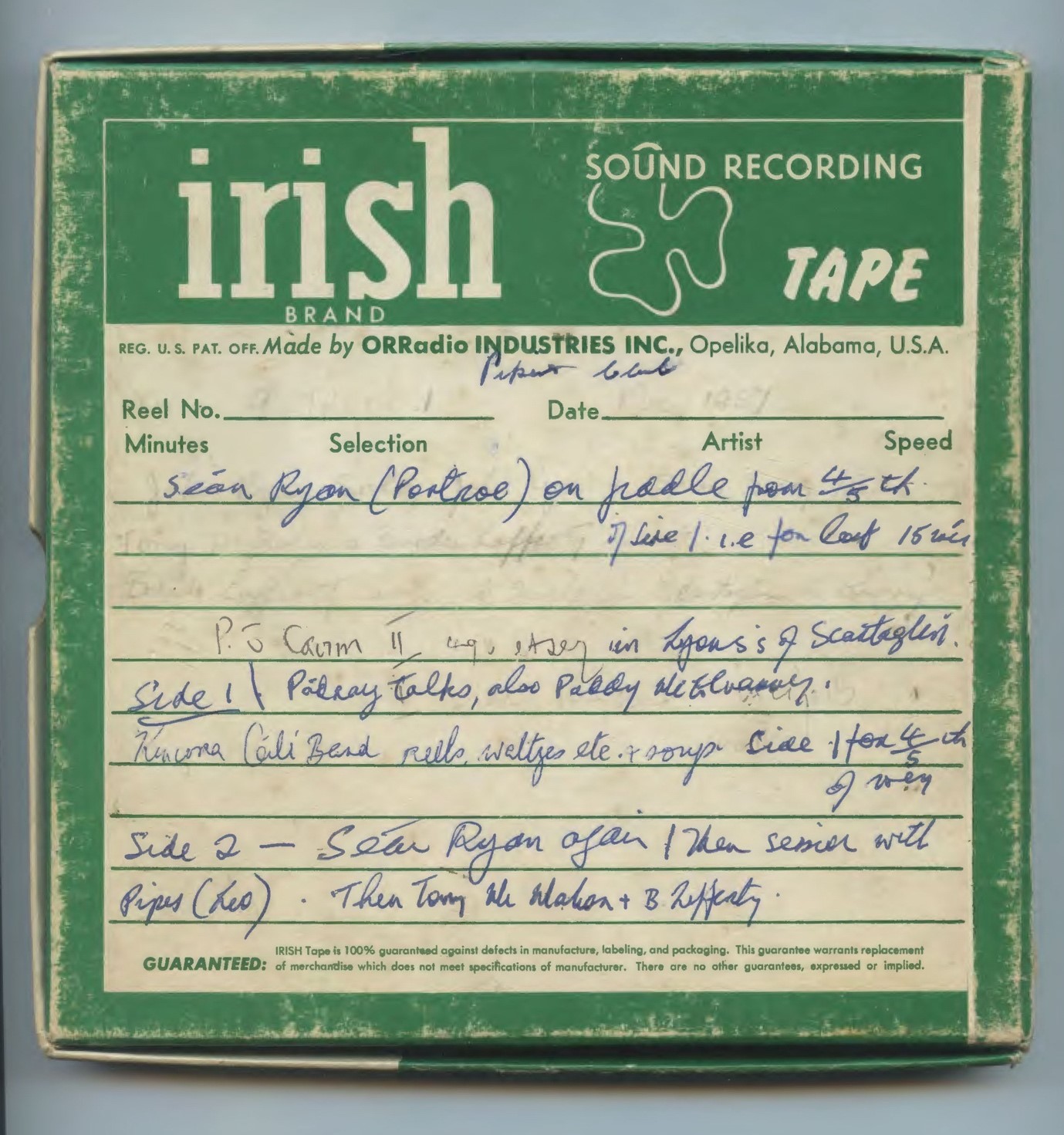 A green reel-to-reel tape box with handwriting on it